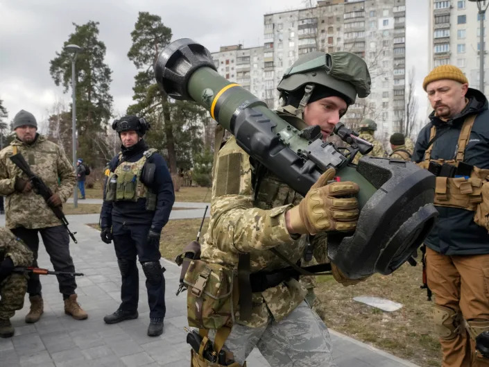 A Ukrainian Territorial Defence Forces member holds an NLAW anti-tank weapon, in the outskirts of Kyiv, Ukraine, Wednesday, March 9, 2022.