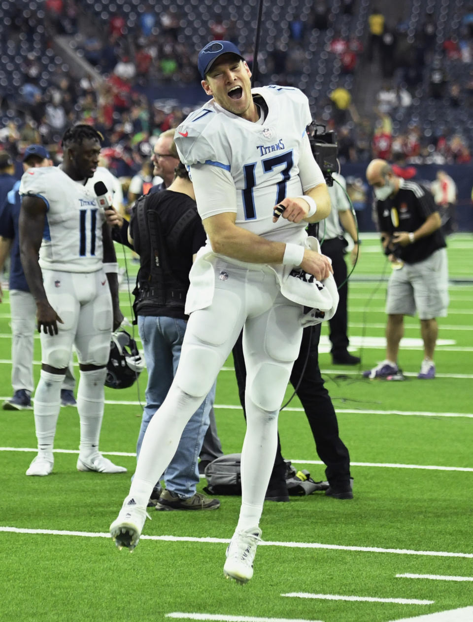 Tennessee Titans quarterback Ryan Tannehill (17) celebrates with fans after their win over the Houston Texans in an NFL football game, Sunday, Jan. 9, 2022, in Houston. (AP Photo/Justin Rex )