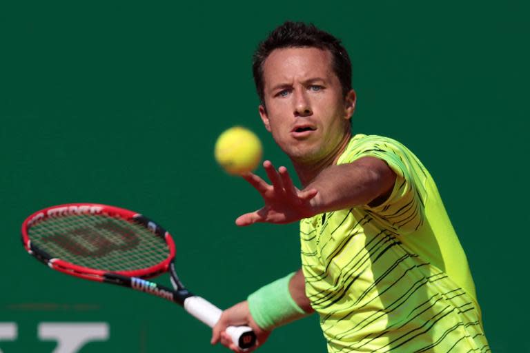 German Philipp Kohlschreiber hits a return at the Monte-Carlo Masters Series Tournament, on April 13, 2015 in Monaco