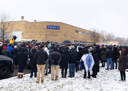 Mourners attend a vigil for five people killed in a shooting incident at Henry Pratt Company in Aurora, Illinois, U.S. February 17, 2019. REUTERS/Robert Chiarito