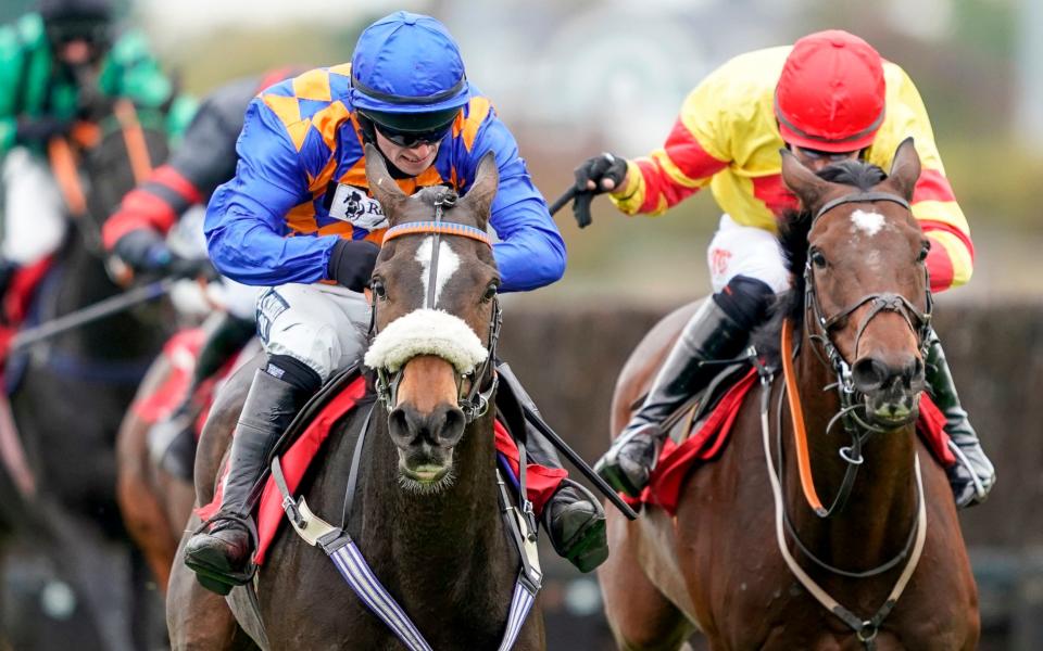 Pontresina ridden by Jonathan Burke (left) clear the last to win The Racing TV Handicap Chaseat Kempton Park  - PA