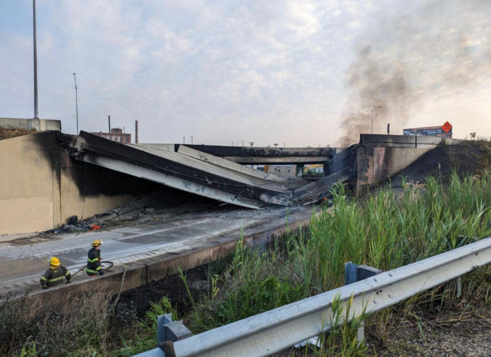 In this handout photo provided by the City of Philadelphia Office of Emergency Management, smoke rises from a collapsed section of the I-95 highway on June 11, 2023 in Philadelphia, Pennsylvania. According to reports, a tanker fire underneath the highway caused the road to collapse. / Credit: Philadelphia Office of Emergency Management