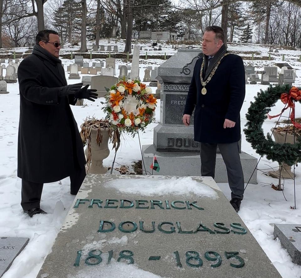 Colm Kelleher and Kenneth B. Morris Jr. place a wreath on behalf of Cork, Ireland, on the gravesite of Frederick Douglass.
