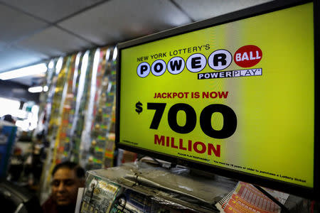 A screen displays the value of the Powerball jackpot at a store in New York City, U.S., August 22, 2017. REUTERS/Brendan McDermid