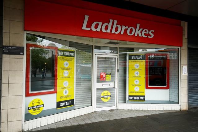 Ladbrokes owner Entain warns on online gaming revenue, shares