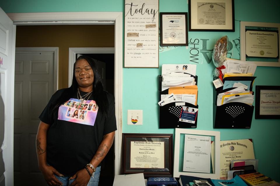 Demetria Murphy’s many degrees and certificates hang from the wall of her home office.