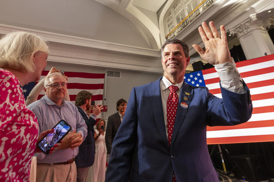 FILE - Virginia state Sen. John McGuire, a candidate in the Republican primary in the state's 5th Congressional District, joins supporters, June 18, 2024, in Lynchburg, Va. On Monday, July 2, 2024, The Associated Press said the race between McGuire and Rep. Bob Good was still too close to call. (AP Photo/Skip Rowland, File)