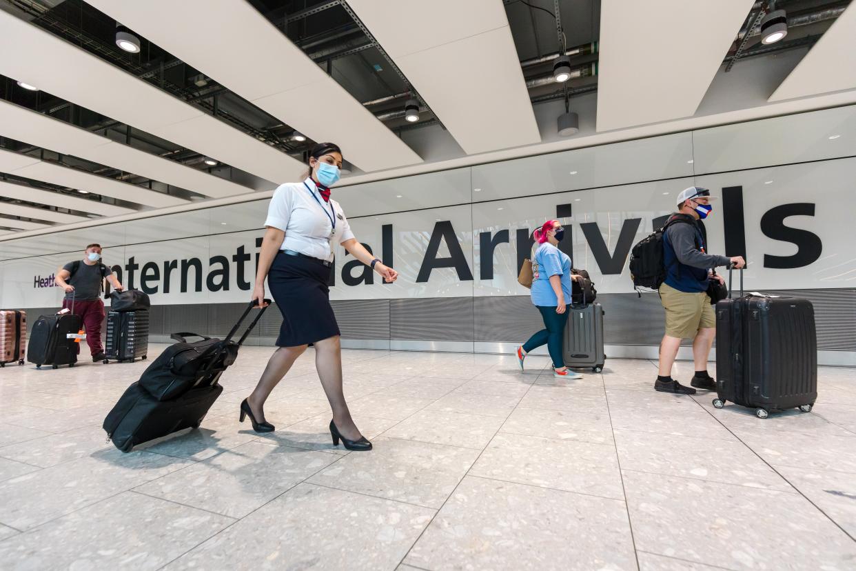 Passengers arrive at Heathrow Airport in London on Tuesday (EPA)