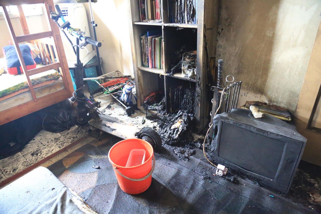 Damage caused by an e-scooter battery that caught fire while charging overnight at Block 260 Yishun St 22. Photo: SCDF