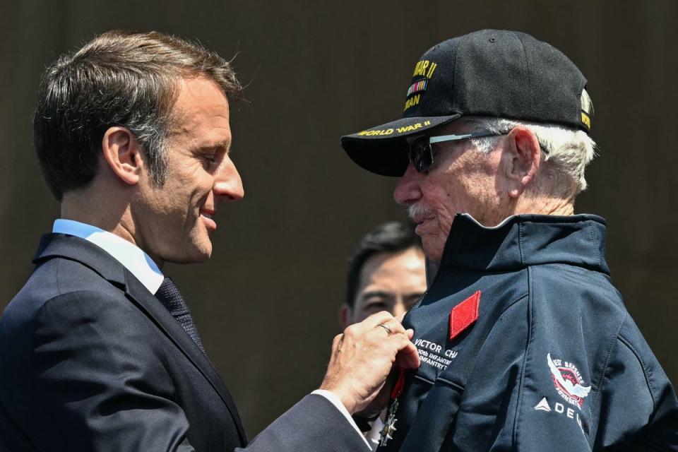 US veteran Victor Chaney receives the honour from the French president (AFP via Getty Images)