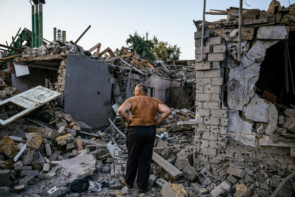 Oleksandr Shulga looks at his destroyed house following a missile strike in Mykolaiv, Ukraine, on Aug. 29, 2022. (Dimitar Dilkoff / AFP - Getty Images file)