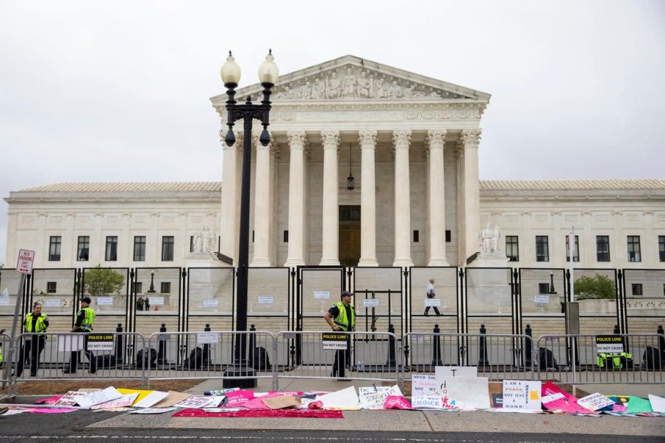 Signs lay in front of fencing during a rally for for abortion rights in front of the Supreme Court of the United States in Washington, Saturday, May 14, 2022, during protests across the country. (AP Photo/Amanda Andrade-Rhoades) (Copyright 2022 The Associated Press. All rights reserved)