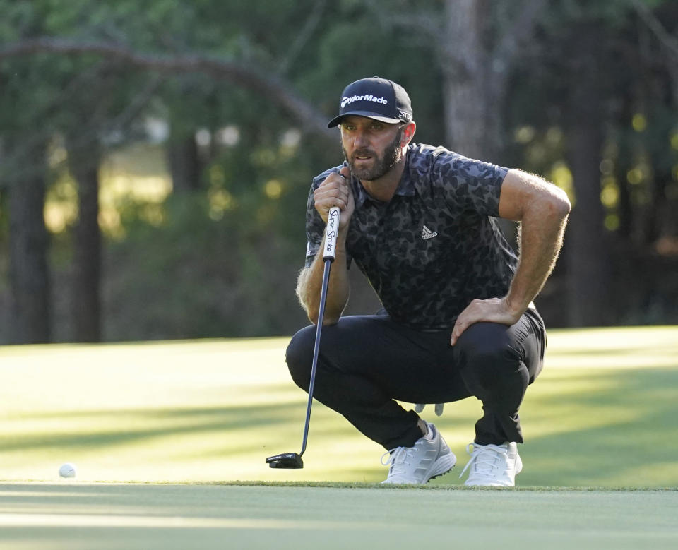 Dustin Johnson lines up a putt on the 15th green during the second round of the LIV Golf Invitational-Boston tournament, Saturday, Sept. 3, 2022, in Bolton, Mass. (AP Photo/Mary Schwalm)