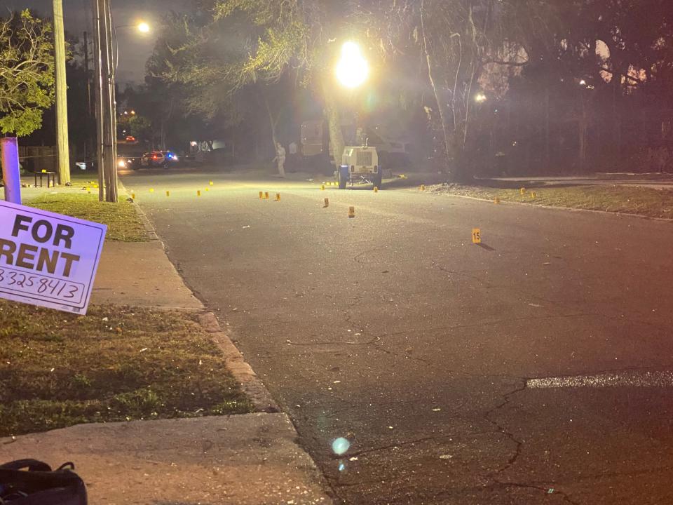 Lakeland police investigate the street where a drive-by shooting took place just on Iowa Avenue just north of Plum Street on Monday.