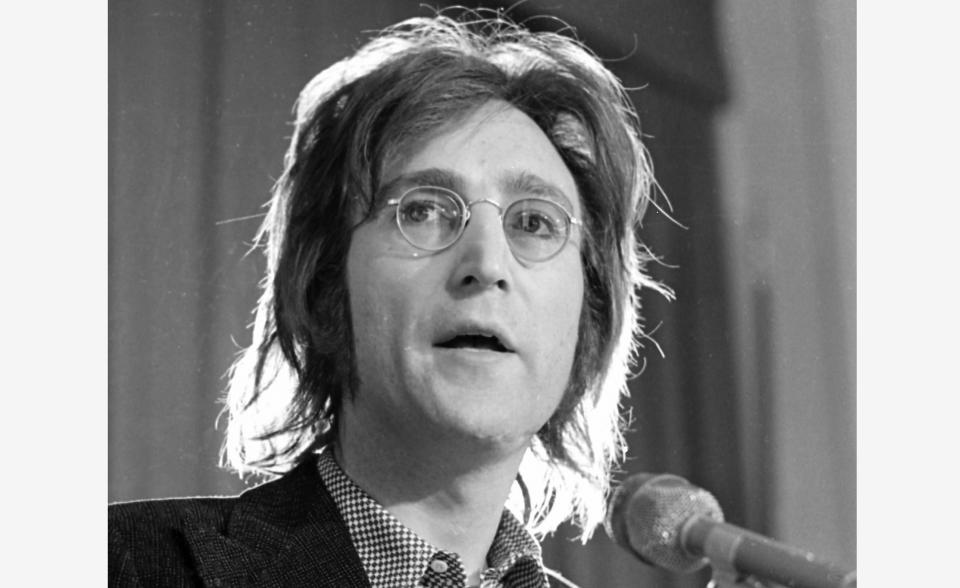 FILE - John Lennon speaks as he arrived for a hearing on his case at U.S. Immigration and Naturalization Service offices in the lower Manhattan section of New York, May 12, 1972. Like so many other events in the year of coronavirus, an annual tribute to John Lennon held in its adopted city of New York will go online. The five-hour event will be streamed for free on Lennon's birthday, October 9, starting at 7 p.m. Eastern time on the LennonTribute.org website. It will feature recorded performances from Patti Smith, Rosanne Cash, Natalie Merchant, Jackson Browne, Jorma Kaukonen and others. (AP Photo/Ron Frehm)