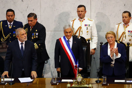 Chile's newly sworn in President Sebastian Pinera stands next to President of the Senate Carlos Montes and former president Michelle Bachelet at the Congress in Valparaiso, Chile March 11, 2018. REUTERS/ Ivan Alvarado