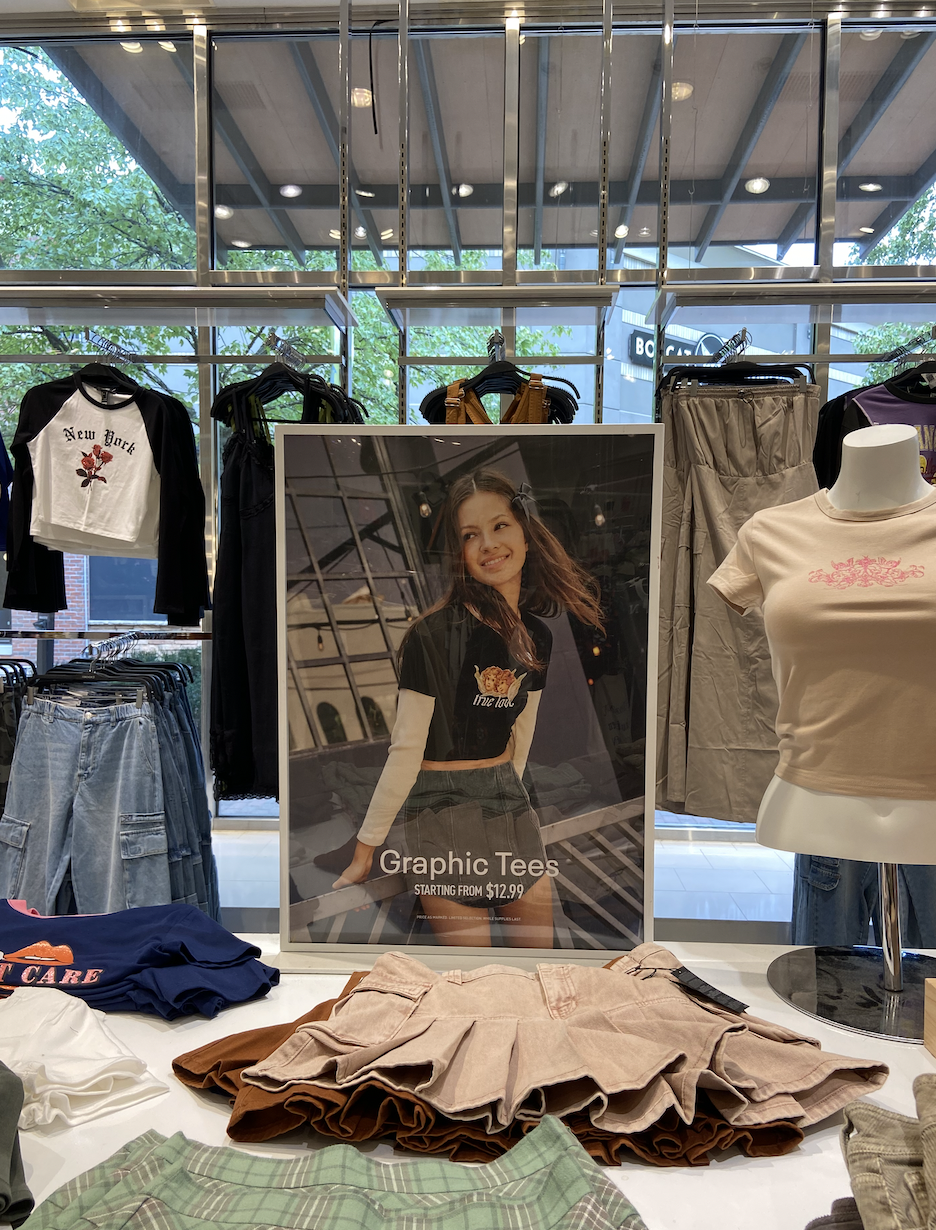 A table of mini skirts and graphic tees reminiscent of what was sold in Delia's back in the early 2000s