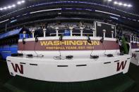 The Washington Football Team benches that the team traveled with are seen in the team area along the sideline at AT&T Stadium before the first half of an NFL football game against the Dallas Cowboys in Arlington, Texas, Sunday, Dec. 26, 2021. (AP Photo/Ron Jenkins)