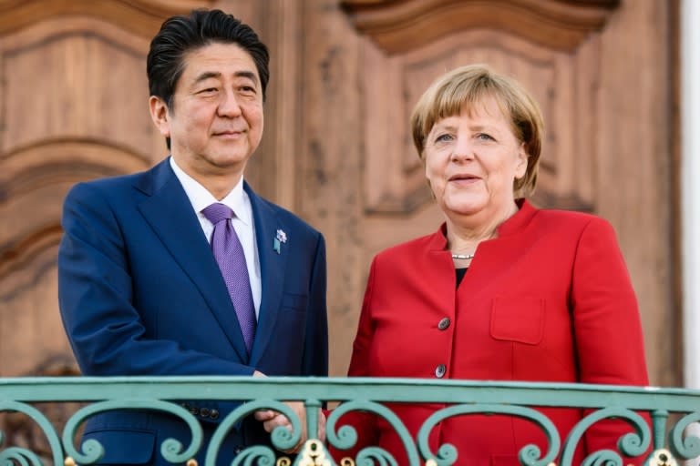 German Chancellor Angela Merkel welcomes Japanese Prime Minister Shinzo Abe for bilateral talks in Gransee on May 4, 2016
