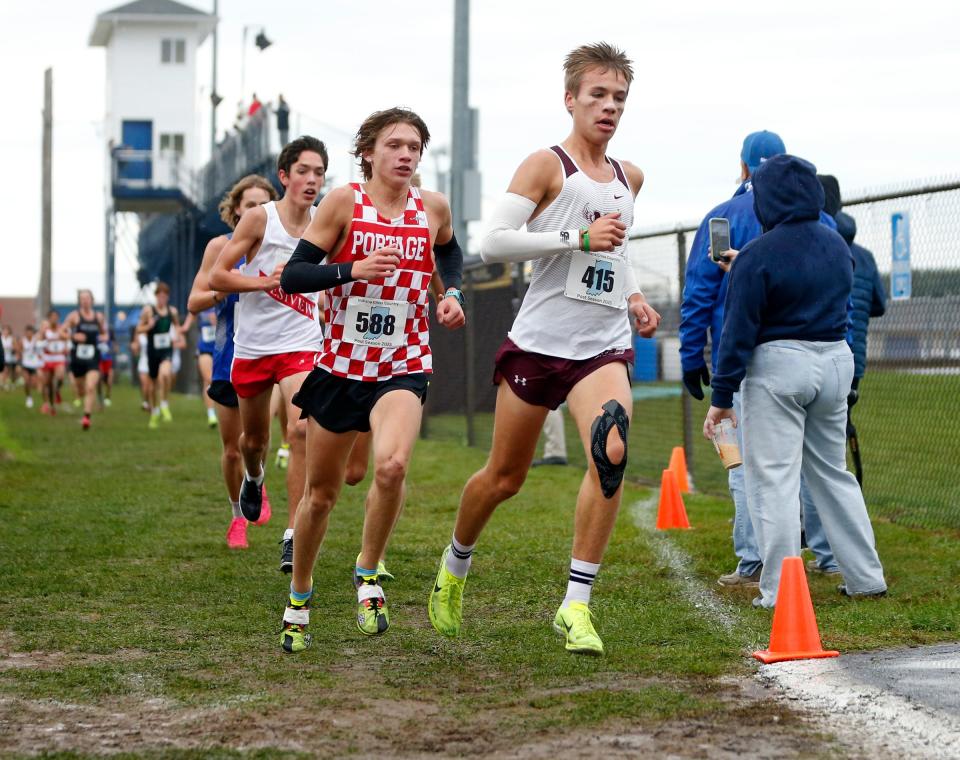 Mishawaka junior Liam Bauschke leads a group of runners at the midway point of the boys cross country regional race Saturday, Oct. 21, 2023, at New Prairie High School in New Carlisle. Bauschke went on to win the race in a time of 15:40.