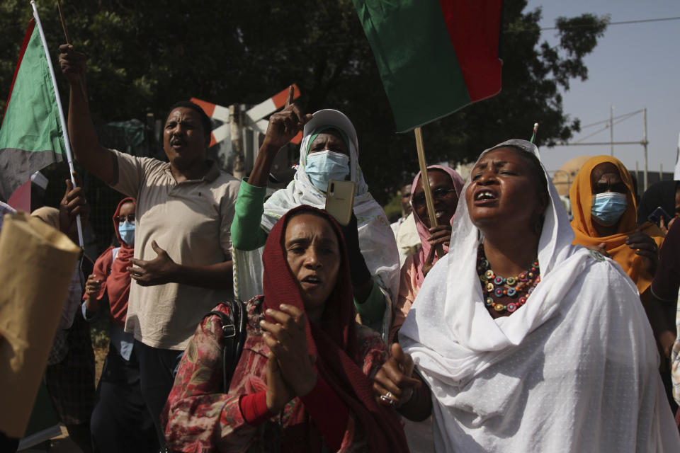 Sudanese participate in a demonstration, in Khartoum, Sudan, Thursday, Sept. 30, 2021. Thousands of Sudanese rallied in the capital of Khartoum against the country's military and demanding the formation of new transitional authorities that would exclusively consist of civilians. Thursday's demonstration accused the generals of derailing the country’s transition to democracy. (AP Photo/Marwan Ali)