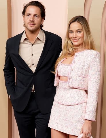 <p>JC Olivera/Getty</p> Margot Robbie and Tom Ackerley