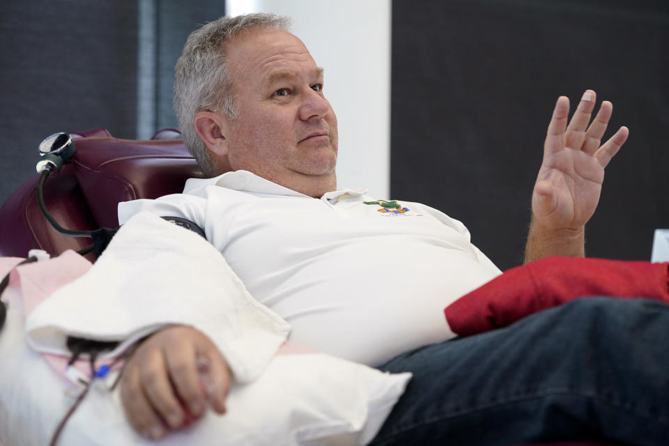 Matt Schermerhorn talks about donating blood at the Impact Life blood center, Friday, Nov. 11, 2022, in Davenport, Iowa. Schermerhorn, 58, is among thousands of current and former military members and civilians who have returned to blood centers across the country after federal health officials lifted a longstanding ban this spring. “It’s a responsibility. It’s a civic duty,” said Schermerhorn, who donated on Veterans Day at the ImpactLife center in Davenport. “You don’t really have to go out of your way too much to help your fellow man.” (AP Photo/Charlie Neibergall)