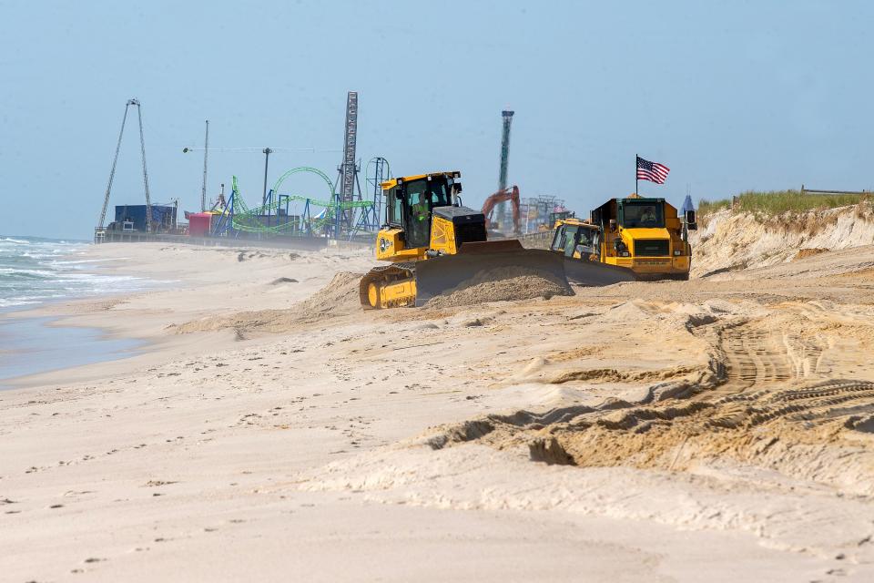 Earle Asphalt repairs beaches, where cliffs were created and fencing and walkovers damaged during winter and spring storms, in Ortley Beach, NJ Wednesday, May 10, 2023.