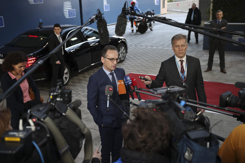 Germany's Foreign Minister Heiko Maas speaks with the media as he arrives to an EU Foreign Ministers meeting at the European Council headquarters in Brussels, Monday, Feb. 18, 2019. US President Donald Trump's demand that European countries take back their nationals fighting in Syria is receiving mixed reactions, as nations pondered how to bring home-grown Islamic State extremists to trial. (AP Photo/Francisco Seco)
