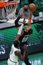 Orlando Magic's Aaron Gordon (00) shoots against Boston Celtics' Jaylen Brown (7) during the first half of an NBA basketball game, Sunday, March 21, 2021, in Boston. (AP Photo/Michael Dwyer)