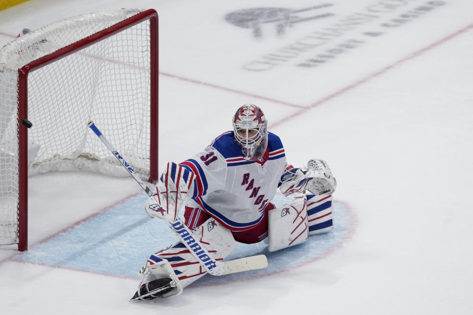 New York Rangers goaltender Igor Shesterkin deflects a San Jose Sharks shot during overtime in an NHL hockey game Tuesday, Jan. 23, 2024, in San Jose, Calif. (AP Photo/Godofredo A. Vásquez)