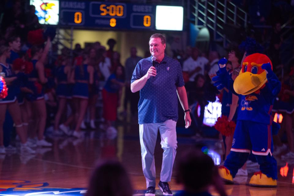 Kansas men's basketball head coach Bill Self walks on to the court of Allen Fieldhouse for Friday's Late Night in the Phog inside Allen Fieldhouse.