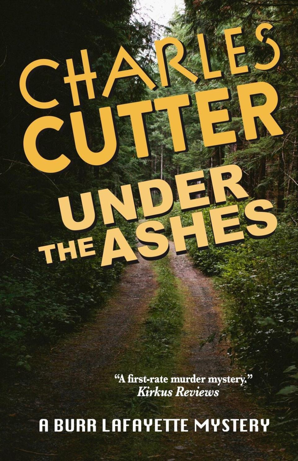 "Under the Ashes" is Charles Cutter's fifth Burr Lafayette mystery.