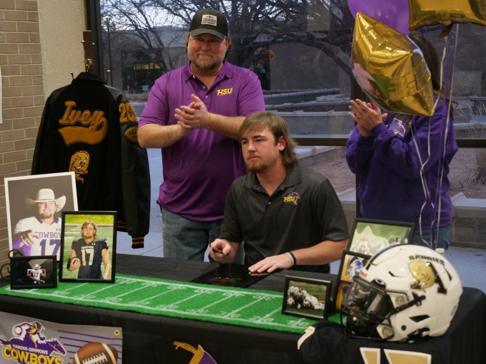 Cooper Ivey (seated) signed his National Letter of Intent to play college football for Hardin Simmons University as part of National Signing Day on Wednesday, February 1st, 2023 at Amarillo High School.