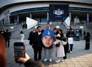 À Séoul, devant le stade où les Dodgers de Los Angeles affrontaient les Padres de San Diego, le 20 mars 2024.. PHOTO Kim Hong-Ji/REUTERS