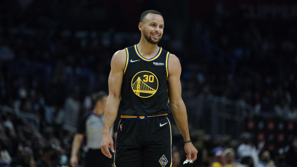 Golden State Warriors guard Stephen Curry smiles.