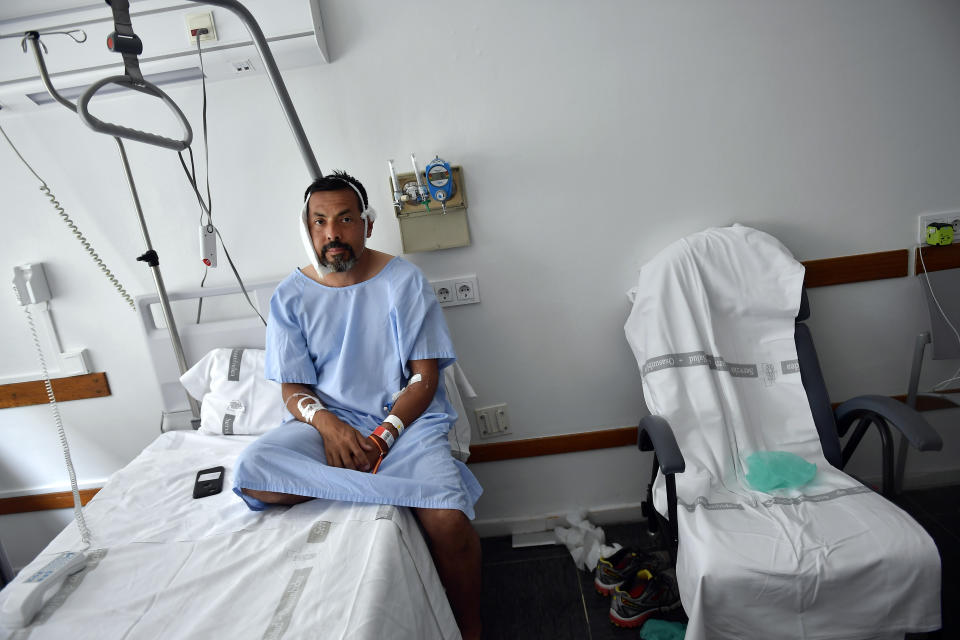 Jaime Alvarez sits in a hospital in Pamplona following the bull run at the San Fermin Festival. He nearly died after a horn drove into his neck. He was taking a selfie at the time.