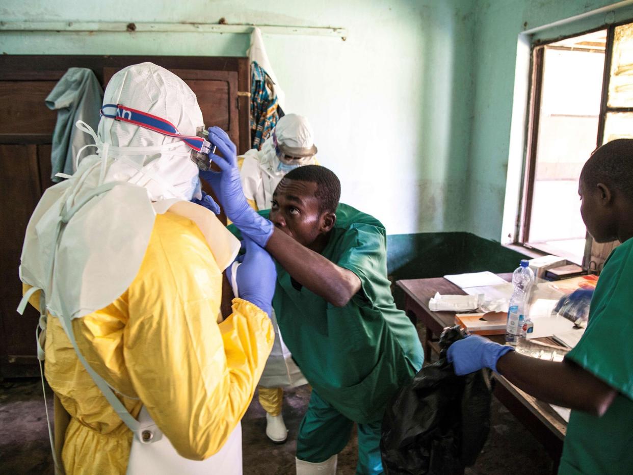 Health workers wear protective equipment as they prepare to attend to suspected Ebola patients at Bikoro Hospital - the epicenter of the latest Ebola outbreak in the Democratic Republic of the Congo: MARK NAFTALIN/AFP/Getty Images