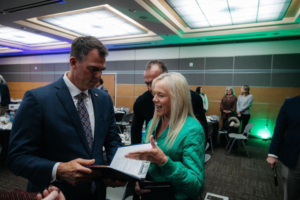 Christy and Keith McPhail of Bartlesville spoke with Gov. Kevin Stitt on Oct. 31 about issues their nonprofit, B the Light, is experiencing with government regulation. Stitt was the keynote speaker at the Bartlesville Chamber of Commerce's forum luncheon that day.