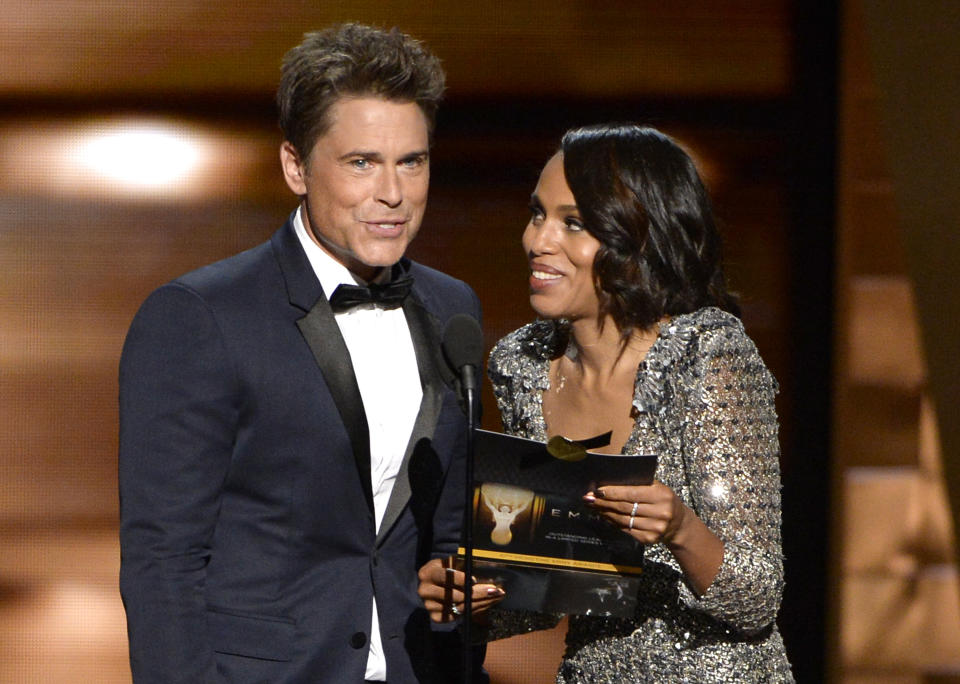 Rob Lowe, left, and Kerry Washington present the award for outstanding lead actress in a limited series or a movie
at the 67th Primetime Emmy Awards on Sunday, Sept. 20, 2015, at the Microsoft Theater in Los Angeles. (Photo by Phil McCarten/Invision for the Television Academy/AP Images)