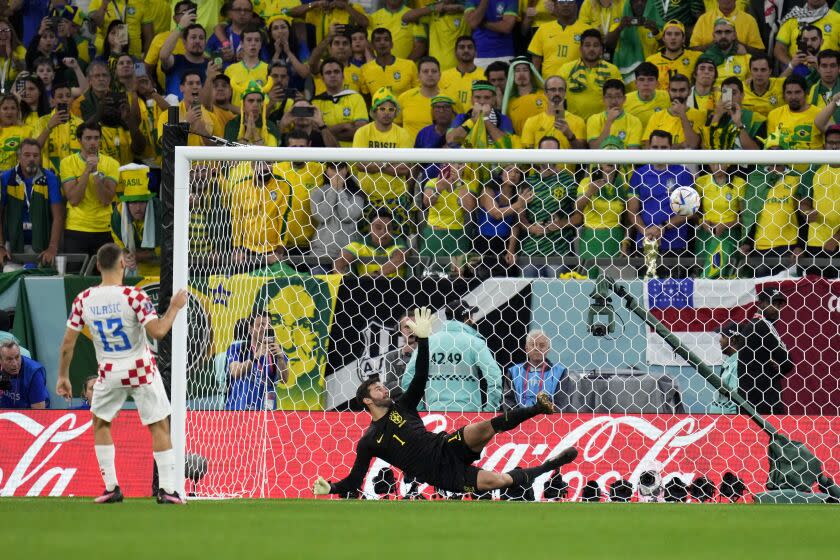 Croatia's Nikola Vlasic scores during the penalty shootout in the World Cup quarterfinal soccer match between Croatia and Brazil, at the Education City Stadium in Al Rayyan, Qatar, Friday, Dec. 9, 2022. (AP Photo/Manu Fernandez)