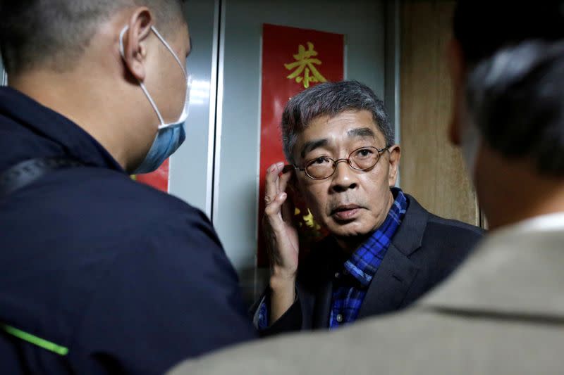 Lam Wing-Kee waits for the elevator on the opening day of his bookstore "Causeway Bay books" in Taipei