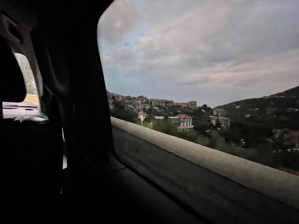 A view of a coastal town from out a car window