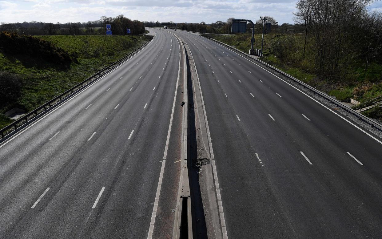 The empty M6 motorway is pictured from junction 18, near Middlewich, north west England on March 29, 2020, as life in Britain continues during the nationwide lockdown to combat the novel coronavirus pandemic. - Prime Minister Boris Johnson warned Saturday the coronavirus outbreak will get worse before it gets better, as the number of deaths in Britain rose 260 in one day to over 1,000. The Conservative leader, who himself tested positive for COVID-19 this week, issued the warning in a leaflet being sent to all UK households explaining how their actions can help limit the spread. "We know things will get worse before they get better," Johnson wrote. (Photo by Paul ELLIS / AFP) (Photo by PAUL ELLIS/AFP via Getty Images)
