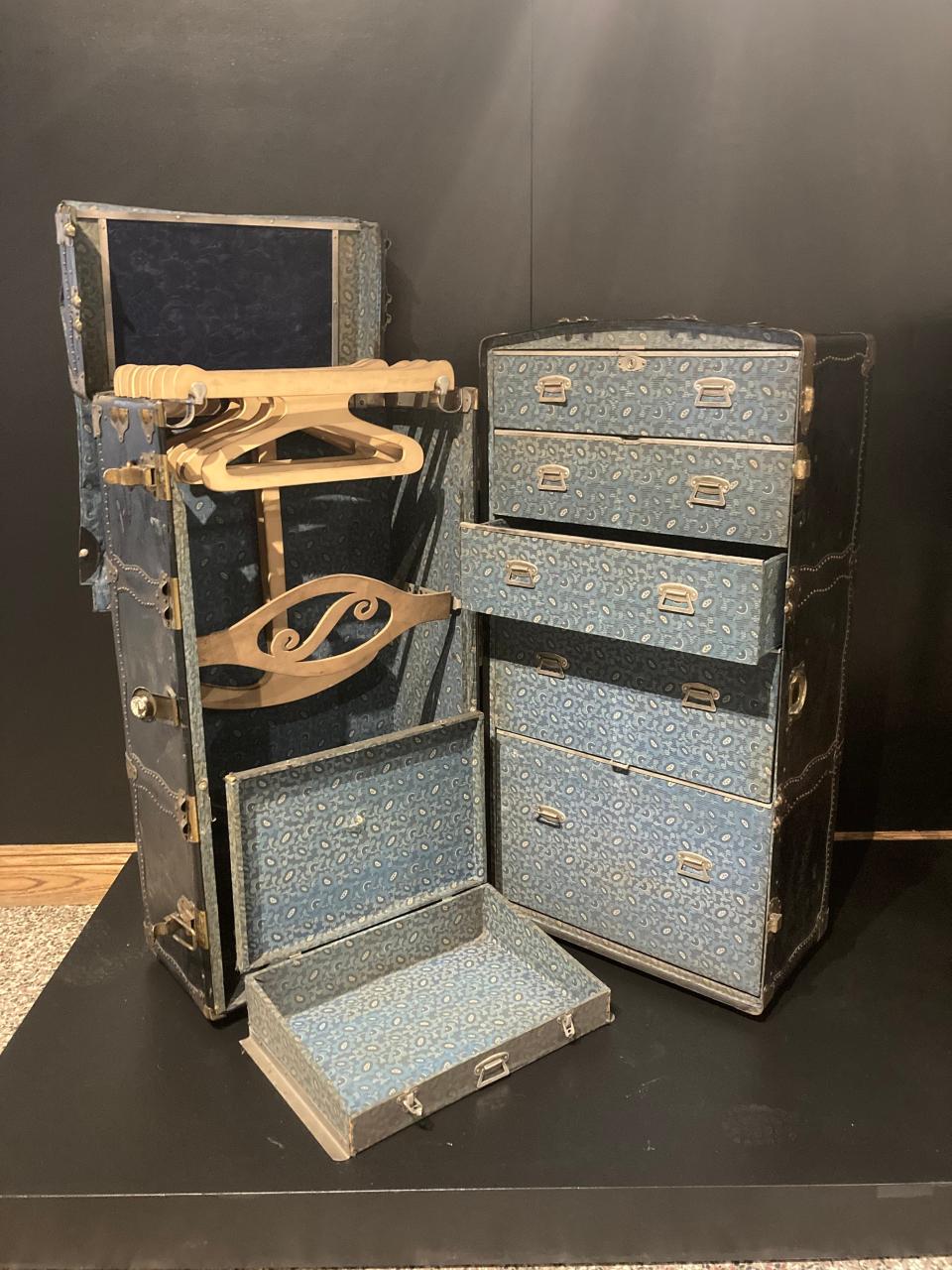 An old-time wardrobe for travel is among artifacts from the collection of McKinley Presidential Library & Museum displayed in a new Keller Gallery exhibition, "A Constellation of Objects."