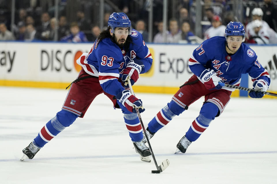 New York Rangers center Mika Zibanejad (93) sets up for a shot on goal in the second period of Game 4 of an NHL hockey Stanley Cup second-round playoff series against the Carolina Hurricanes, Tuesday, May 24, 2022, in New York. (AP Photo/John Minchillo)