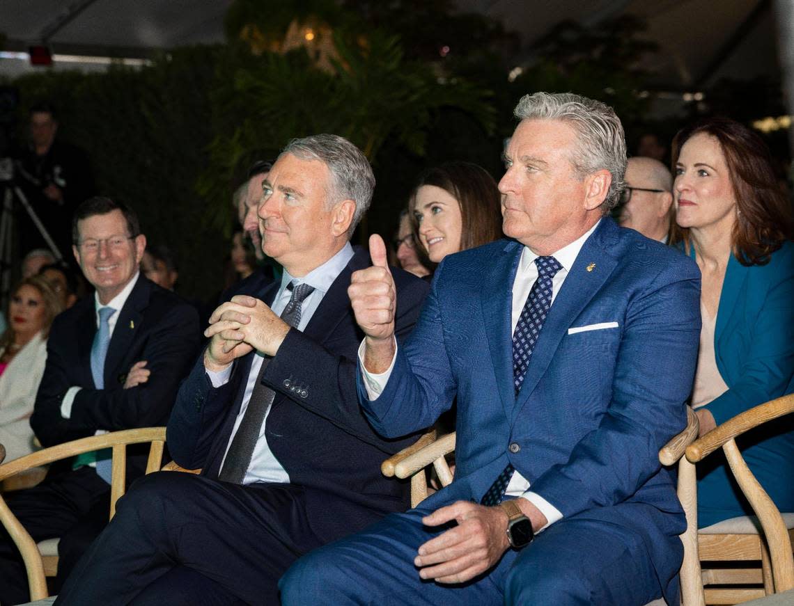 Bo Boulenger, president and CEO of Baptist Health, right, gives a thumbs up during a ceremony recognizing Ken Griffin, Citadel CEO, left, for his donation to the Miami Neuroscience Institute on Tuesday, March 19, 2024, at the Baptist Health Baptist Hospital in Miami, Fla. It will be the future home of the Kenneth C. Griffin Center. Alie Skowronski/askowronski@miamiherald.com