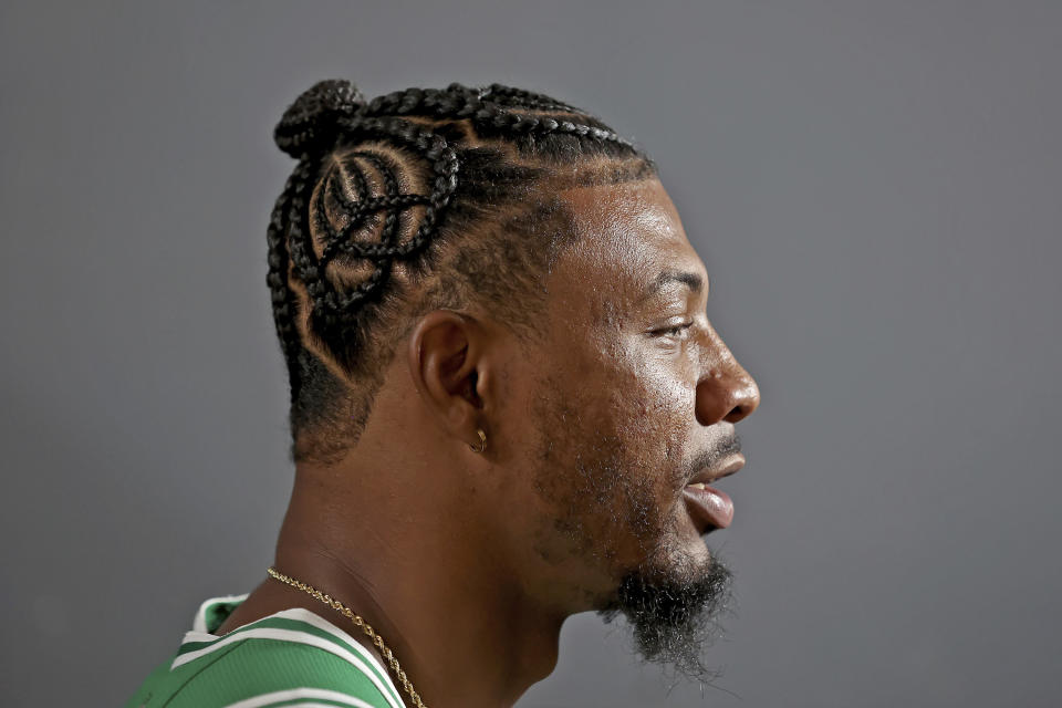 Boston Celtics guard Marcus Smart speaks during an interview during the Boston Celtics Media Day, Monday, Sept. 27, 2021, in Canton, Mass. (AP Photo/Mary Schwalm)