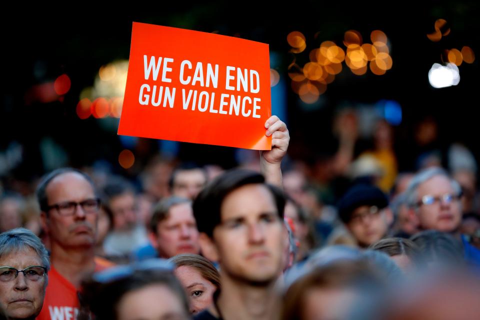 Mourners gather for a vigil at the scene of a mass shooting on Aug. 4, 2019, in Dayton, Ohio.