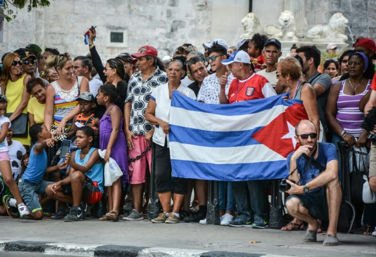 Cubans wait for passengers of the first US-to-Cuba cruise to disembark in the port of Havana, on May 2, 2016